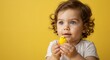 © NN AI - Caucasian toddler with curly hair holding yellow chick toy against bright background. Child with blue eyes examining Easter decoration. Spring holiday. Childhood innocence. Seasonal celebration