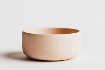 Poster - A close-up of a simple, minimalist beige ceramic bowl on a white background, showcasing its textured surface and elegant, rounded shape for home decor and food styling.