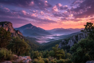 Aufkleber - Majestic mountain landscape at dawn with mist and vibrant clouds in the sky