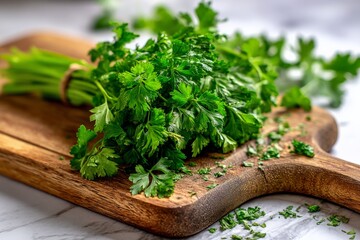 Poster - Fresh cilantro on a wooden cutting board with chopped leaves scattered around, perfect for culinary use