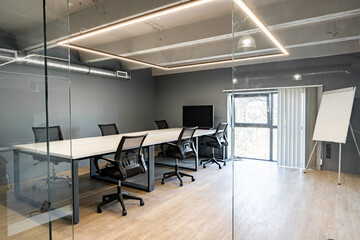 Poster - Conference room with modern design and glass walls in a corporate office setting during daylight