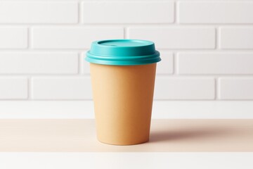 Poster - Minimal coffee cup with turquoise lid on wood surface against white brick wall background for branding or poster design mockup template concept.