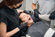 © Svitlana - Woman dental technician making anaesthetic injection to male patient