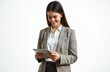 © Maryna - Smiling businesswoman working digital tablet on white background. Young adult wearing checked suit, white shirt. Confident lady executive corporate office. Touchpad technology. Modern work.