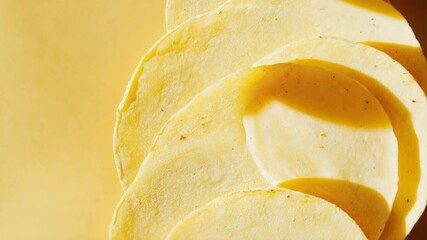 Aufkleber - Stack of tortillas on a bright yellow background, ready for use or decoration