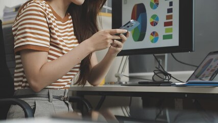 UX/UI designer working on wireframes for a website and mobile app prototype, surrounded by sketches of user-flow and design tools, in concept of website and mobile application design concept.