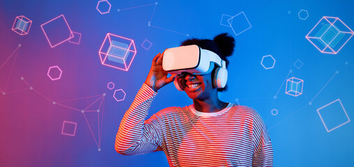 Poster - african girl with vr glasses standing at blue and pink background and looking at floating geometric 