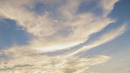 Poster - Ephemeral Hues: A mesmerizing expanse of clouds graces the cerulean sky, painted with delicate shades of light and shadow, offering a serene panorama.