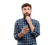 © Marin Studio - A man with a beard, holding a phone, looks up thoughtfully with hand on his chin.