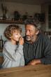 © Ala - Engaging in a nurturing skincare routine at home between father and son