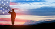 © hamara - Silhouette of soldier saluting on background of USA flag. Greeting card for Veterans Day, Memorial Day.