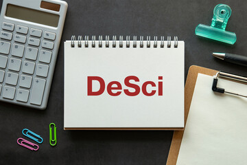 Poster - there is notebook with the word desci. it is an abbreviation for desci as eye-catching image.