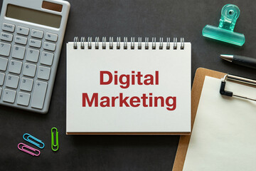 Poster - there is notebook with the word digital marketing. it is as an eye-catching image.