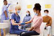 © Prostock-studio - Covid-19 Vaccination. African American Teen Girl Receiving Coronavirus Vaccine Injection Shot In Arm Sitting With Doctor In Hospital. Corona Virus Medicine Treatment And Prevention. Selective Focus