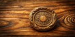 © Songkran - Ancient gold wax seal with empty center on ornate wooden background, surrounded by intricate carvings and subtle texture details
