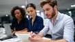 © NAPHAT - Diverse Team of Professionals Collaborating in Modern Office Environment with Technology at Night