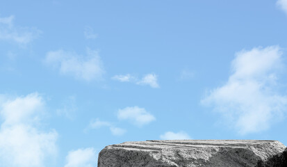 Wall Mural - sky ,cloud with rock stone podium on blue background, grey rock sea podium outdoor on clear blue sky