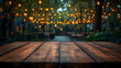 © Diki - Rustic Wooden Table at Night with Warm String Lights