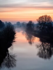 Wall Mural - serene river at dawn reflecting trees and colorful sky in tranquil landscape