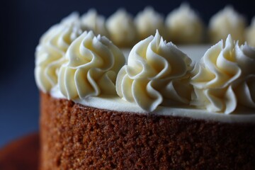 Aufkleber - Delicious cream-topped cake with intricate frosting design displayed on a wooden board in a cozy kitchen