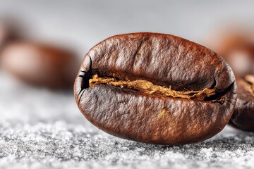 Poster - Coffee bean close-up showcasing rich texture and color on a gray surface with scattered coffee beans in the background