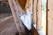 © Elena - Happy Child Playing in Wooden Structure Outdoors