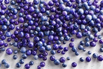 Poster - An artistic array of blue and purple spheres with speckled details, scattered on a bright white surface creates a captivating abstract composition, perfect for modern designs.