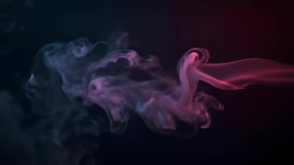 Poster - Smoke in vibrant colors flows and twists against a dark background, creating interesting shapes and visuals with gradual movements