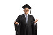 © Ljupco Smokovski - Mature man in a graduation gown standing and gesturing with hands