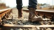 © suyu - Close up of male legs walking along railway tracks, symbolizing journey, danger, solitude, and choices. Concept of risk, freedom, escape, travel, and the path of life on uncertain ground