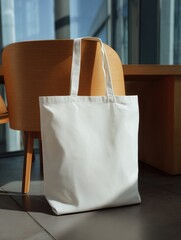 Aufkleber - White tote bag resting on chair indoors minimalist style product shot no people eco friendly reusable shopping bag
