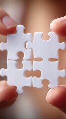 Aufkleber - Close-up of Fingers Holding Four White Jigsaw Puzzle Pieces Together, Macro Shot, Emphasizing Connection and Problem Solving