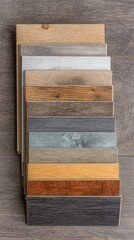 Poster - Close-up of Stacked Vinyl Flooring Planks in Assorted Colors and Textures for Home Improvement Projects