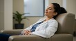 © SRD - Relaxed Female Doctor Resting in Chair High-Resolution Photo Download