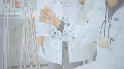 Poster - Man adjusting cables and causing network overlay fading while lab colleague analyzing connections