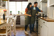 © Wavebreak Media - Asian couple cooking together in kitchen, enjoying time and preparing meal