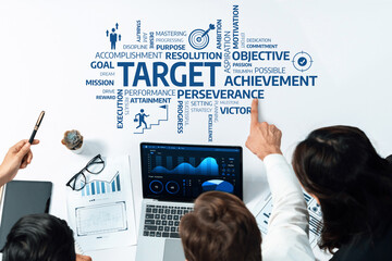 Aufkleber - A group of professionals collaborates to discuss strategic objectives and performance metrics, analyzing data displayed on a laptop for better business outcomes. Amity