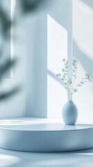 Poster - Soft Morning Light Illuminating a Minimalist Vase With Delicate Greenery in a Serene White Interior Space