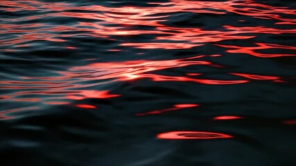 Poster - Beautiful rippling water at sunset reflecting warm hues in a serene coastal setting