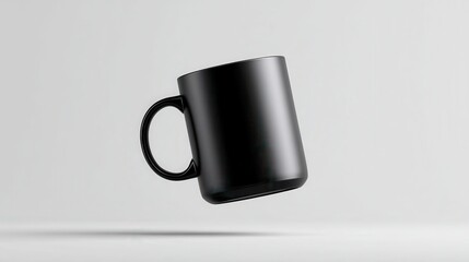Poster - Sleek black ceramic mug floating against pristine white surface, highlighting minimalist design and clean visual composition