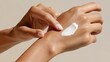 © Newleks - Female hands smoothing moisturizer on face, nourishing delicate skin, ensuring healthy glow and soft complexion during morning beauty regimen