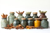 An assortment of spices and herbs are arranged in rustic jars and vases on a white background, creating a natural and aromatic display.
