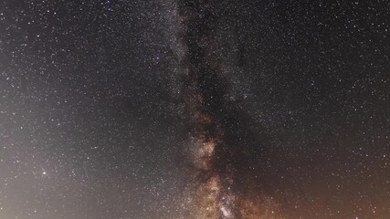Wall Mural - beautiful night sky time lapse with bright milky way galaxy on dark sky. starry night background.