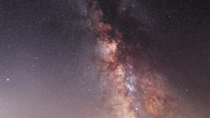 Wall Mural - beautiful night sky time lapse with bright milky way galaxy on dark sky. starry night background.