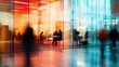 © Forex - Blurry interior view of a modern office building with people working