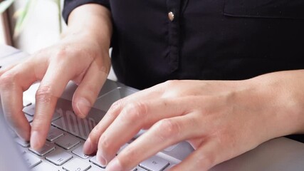 Poster - Businesswoman on laptop with a cloud filling up, with a percentage achieved upload count, on the keyboard