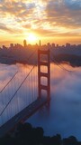 Golden Gate Bridge at sunrise, city in mist