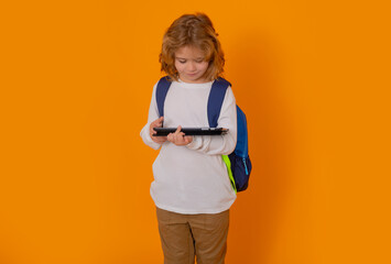 Fototapete - School boy using tablet. School and kids. Cute blonde child with tablet learning. Knowledge day.
