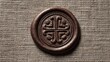 © Amazing Kingdom - Brown wax seal with embossed Celtic knot design, on linen texture background, symbolizing authenticity, heritage, and tradition