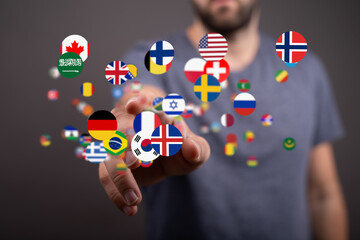 Poster - A man interacts with a digital display of flags from countries worldwide, symbolizing global connectivity.